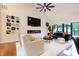 Bright living room featuring vaulted ceilings, a modern fireplace and stylish decor at 11911 W Grandview Dr, Columbus, IN 47201