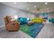 Spacious living room with diverse seating, a ceiling fan, and vibrant decor at 11911 W Grandview Dr, Columbus, IN 47201