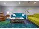 Stylish living room with modern furniture, colorful rug, and ample lighting at 11911 W Grandview Dr, Columbus, IN 47201