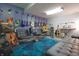 Eclectic music room filled with guitars, a keyboard, and comfortable seating at 11911 W Grandview Dr, Columbus, IN 47201