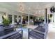 This stunning outdoor patio offers plenty of seating, a fan, and overhead lights for evening enjoyment at 11911 W Grandview Dr, Columbus, IN 47201