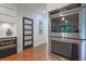 Kitchen with stainless steel double ovens next to a five-panel door at 11911 W Grandview Dr, Columbus, IN 47201