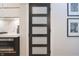 Kitchen pantry door featuring a modern five-panel design with glass inserts at 11911 W Grandview Dr, Columbus, IN 47201
