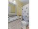 Bright bathroom featuring granite counters, modern fixtures, and a shower with patterned curtain at 12524 Trophy Dr, Fishers, IN 46038