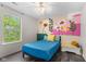 Bright bedroom with floral mural accent wall, stylish furnishings, and natural light at 12524 Trophy Dr, Fishers, IN 46038