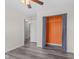 Minimalist bedroom featuring plank flooring, natural light and a closet with orange paint at 12524 Trophy Dr, Fishers, IN 46038