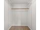 Empty walk-in closet with carpet, wooden rod, and wire shelving ready for organization at 12524 Trophy Dr, Fishers, IN 46038