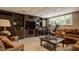 Finished basement featuring a comfortable lounge area with built-in shelving and media center at 12539 Pebblepointe Pass, Carmel, IN 46033