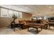 Finished basement featuring a comfortable lounge area with built-in shelving and media center at 12539 Pebblepointe Pass, Carmel, IN 46033