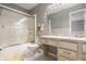 Well-lit bathroom showcasing a shower, vanity, and a toilet offering relaxation and comfort at 12539 Pebblepointe Pass, Carmel, IN 46033