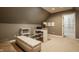 Bonus room featuring a cozy seating area, a built-in desk, and ample storage space at 12539 Pebblepointe Pass, Carmel, IN 46033