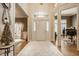 Grand foyer with soaring ceilings, hardwood floors, and a view into adjoining living spaces at 12539 Pebblepointe Pass, Carmel, IN 46033
