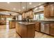 Spacious kitchen featuring custom cabinets, granite countertops, and a functional center island at 12539 Pebblepointe Pass, Carmel, IN 46033