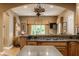 Open-concept kitchen offering views into the adjacent Gathering room, perfect for entertaining at 12539 Pebblepointe Pass, Carmel, IN 46033
