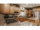 Gourmet kitchen with updated appliances, granite countertops, and stylish backsplash at 12539 Pebblepointe Pass, Carmel, IN 46033