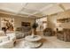 Spacious living room featuring comfortable seating, recessed lighting, with open access to dining area, perfect for entertaining at 12539 Pebblepointe Pass, Carmel, IN 46033