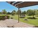 Expansive backyard with a wood deck, firepit, and trampoline at 12677 Honors Dr, Carmel, IN 46033