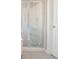 Bathroom shower with glass door and white tile at 12677 Honors Dr, Carmel, IN 46033
