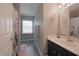 Bathroom featuring a single sink vanity and a shower/tub with cactus print shower curtain at 12677 Honors Dr, Carmel, IN 46033