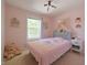 Pink bedroom with a cute bed, decor, and carpeted floors at 12677 Honors Dr, Carmel, IN 46033
