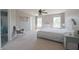 Primary bedroom with a ceiling fan, natural light, carpeted floors and a sitting area at 12677 Honors Dr, Carmel, IN 46033