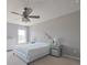 Comfortable bedroom with a ceiling fan, neutral paint, and carpeted floors at 12677 Honors Dr, Carmel, IN 46033