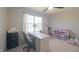 Bedroom with ceiling fan featuring a desk by the window and shelves with colorful toys at 12677 Honors Dr, Carmel, IN 46033