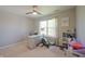 Bedroom with ceiling fan featuring a desk by the window, bookshelf and exercise equipment at 12677 Honors Dr, Carmel, IN 46033