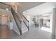 Inviting entryway showcases a staircase, and open access to the kitchen and dining area at 12677 Honors Dr, Carmel, IN 46033