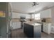 Modern kitchen boasts stainless steel appliances, granite countertops, and a central island at 12677 Honors Dr, Carmel, IN 46033