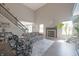 Bright and airy living room with a fireplace, tall ceilings, and comfortable seating at 12677 Honors Dr, Carmel, IN 46033
