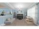 Comfortable living room area with piano, plush sofa and a toy table at 12677 Honors Dr, Carmel, IN 46033