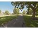 Neighborhood view featuring a walking path, mature trees, and well-maintained landscaping at 12677 Honors Dr, Carmel, IN 46033