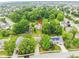 Beautiful aerial view of a home nestled amongst lush trees in a well-maintained residential neighborhood at 13911 Naples Dr, Fishers, IN 46038