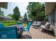 Inviting outdoor deck featuring a dining table with chairs and comfortable lounge seating at 13911 Naples Dr, Fishers, IN 46038