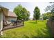 A well-maintained lawn and patio area in the back yard with a table and chairs at 13911 Naples Dr, Fishers, IN 46038