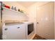 Functional laundry room with washer, dryer, and ample storage space at 13911 Naples Dr, Fishers, IN 46038
