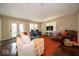 Cozy living room with comfortable seating, a large TV, and access to the outdoor deck at 13911 Naples Dr, Fishers, IN 46038