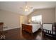 Vaulted ceiling bedroom with hardwood flooring, ceiling fan, and natural light at 13911 Naples Dr, Fishers, IN 46038