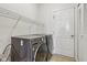 Functional laundry room with modern washer and dryer units at 14036 Rayners Ln, Fishers, IN 46037