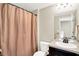 Bathroom featuring a shower with a neutral-colored curtain and a vanity area at 14499 Milton Rd, Fishers, IN 46037