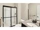Bathroom with a modern shower stall, granite countertop, and elegant fixtures at 14499 Milton Rd, Fishers, IN 46037