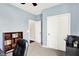 Bright bedroom featuring a large window, closet, and contemporary desk for a workspace at 14499 Milton Rd, Fishers, IN 46037
