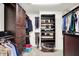 Walk-in closet with custom shelving and storage for clothes and shoes at 14499 Milton Rd, Fishers, IN 46037