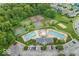 Aerial shot of the community clubhouse featuring pools, tennis courts, and a playground area at 14499 Milton Rd, Fishers, IN 46037