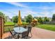 Wooden deck area with patio furniture and a view of the landscaped backyard at 14499 Milton Rd, Fishers, IN 46037