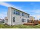 Exterior of the home showing the siding, windows, and a wooden deck with patio furniture at 14499 Milton Rd, Fishers, IN 46037