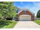 Charming two-story home with a brick facade and well-manicured lawn at 14499 Milton Rd, Fishers, IN 46037