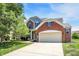 Charming two-story home with a brick facade and well-manicured lawn at 14499 Milton Rd, Fishers, IN 46037