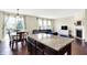 Open kitchen features a granite island that is integrated with the living area at 14499 Milton Rd, Fishers, IN 46037